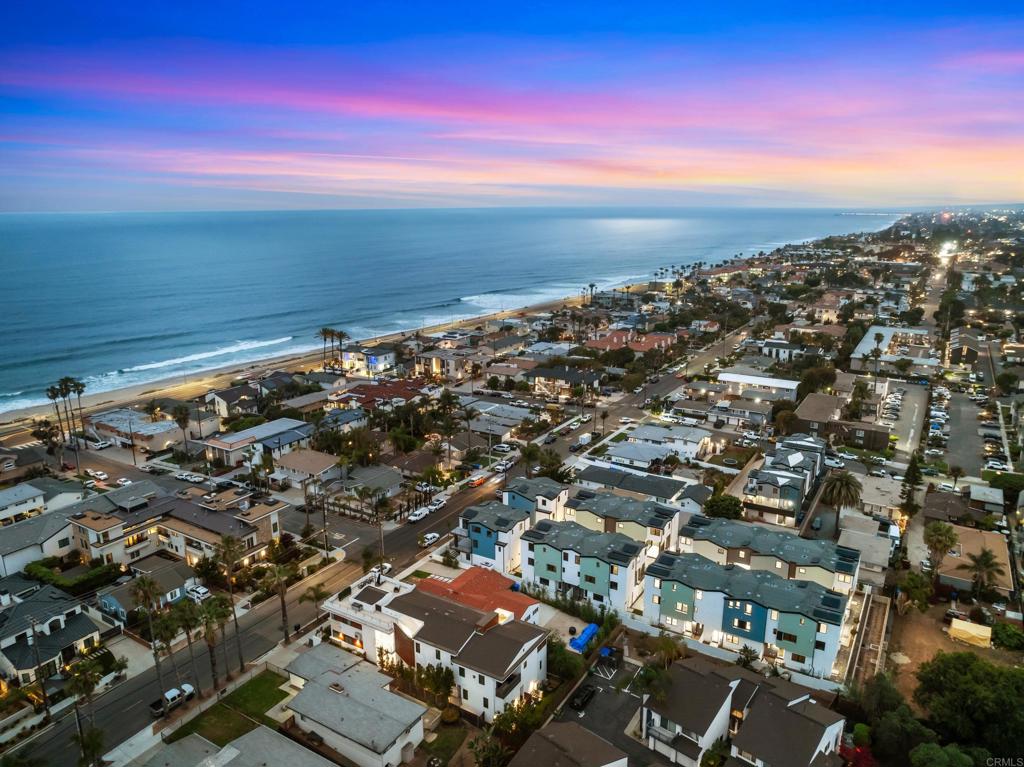 LAST HOME AT TWELVE WEST - Brand NEW Coastal Townhome Just Steps from the Beach! *Builder is offering a generous rate buydown incentive. Special financing options available to qualified buyers.* Welcome to 3578 Garfield St, an exquisite 3-story townhome nestled in one of Carlsbad's most sought-after beach neighborhoods, just one block to the ocean. Offering 2,054 sq. ft. of luxurious living space, this new Twelve West home features 3 spacious bedrooms, a bonus room/office on the first floor, and 2.5 bathrooms. Enjoy seamless indoor-outdoor living with a deck off the great room and a private, fenced backyard. Designed with modern coastal living in mind, this stunning home includes European oak wood floors throughout (no carpet), ample storage, owned solar panels, smart home technology, and a direct-access 2-car garage. The gourmet kitchen is equipped with high-end Wolf and SubZero appliances, including a 36" dual fuel 6-burner gas range, microwave drawer, SubZero refrigerator and separate wine fridge, quartz countertops, a large island, and soft close, white shaker cabinetry. The walk-in pantry, wine bar with floating shelves, designer tile, premium Kohler plumbing fixtures, and elegant lighting complete the space. The primary suite features vaulted ceilings, a large walk-in closet, and a spa-like bathroom with a luxurious shower and high-end finishes. Twelve West is nestled just a block from the beach and a quick stroll into downtown Carlsbad Village, offering easy access to beaches, shops, restaurants, parks, and trails. This new coastal community perfectly blends contemporary design with the relaxed lifestyle of the Pacific Ocean.
