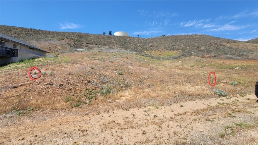 This APN # 373-133-013 lot 14 and the one next door APN # 373-133-012 lot 13 is for sale. This price is for one. There is a house one or two lots to the left and another house across the street.  There is water close by and power close by.