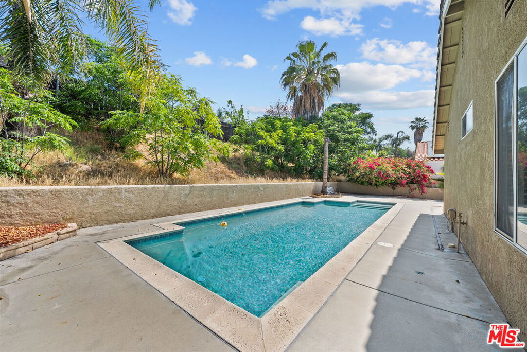 Welcome to this beautifully upgraded single-story ranch-style home nestled in a quiet, established neighborhood north of the 60 Freeway in Moreno Valley. Featuring over $70,000 in recent improvements, this 3-bedroom, 2-bath home offers stylish living and thoughtful upgrades throughout. Inside, enjoy a freshly remodeled kitchen (JUNE) with granite countertops, stainless steel appliances, and updated cabinetry. The spacious layout includes a formal living room and a cozy family room with a fireplace, complemented by new flooring, fresh interior paint, new central A/C, and an updated electrical panel. Solar panels are already in place to help lower energy costs. A finished garage adds versatility for storage, hobbies, or a home gym. Step into the backyard and relax by your sparkling POOL, a perfect outdoor retreat for sunny California days. Conveniently located near top-rated schools, parks, shopping, and major freeways, this move-in-ready home checks every box!