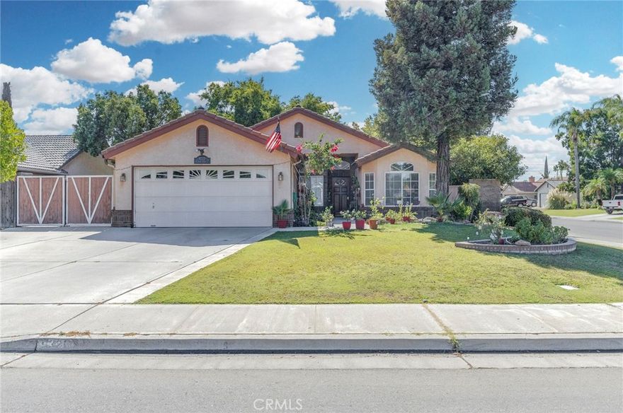 Charming Bakersfield home featuring tile floors in the entry, kitchen, dining, and bathrooms, with plush carpet in the bedrooms, hallway, and living room. High ceilings with ceiling fans throughout create a bright, airy feel. Spacious backyard perfect for entertaining and outdoor enjoyment.