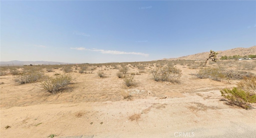 This 9-acre lot in Apple Valley offers a unique opportunity for development, whether you're interested in building a custom home, starting a small ranch, or making a strategic land investment. With expansive skies, beautiful sunsets, and panoramic mountain views, the location provides a peaceful atmosphere in a naturally scenic setting. The property is ideally situated to offer both a sense of seclusion and convenient access to nearby town amenities. This open and versatile land holds exertional potential for a variety of uses.