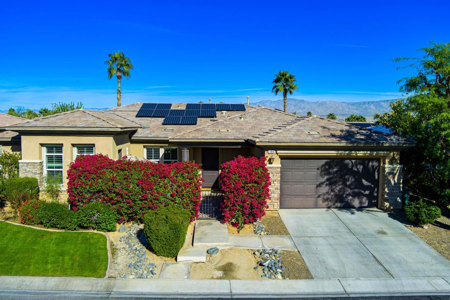 Nestled on one of the most desirable cul-de-sac streets in the gated community of Brenna, this beautifully maintained home offers refined comfort and exceptional privacy. Step inside to an inviting entry accented by a slab-granite pony wall, leading to a separate formal dining room and a spacious great room complete with custom built-ins, media niche, and cozy fireplace.The gourmet kitchen is designed for both everyday living and effortless entertaining, featuring slab-granite countertops, stainless steel appliances, a gas cooktop with pot filler, and convenient pull-out cabinet drawers.With 4 bedrooms and 3.5 baths, this home includes a standout feature: the fourth bedroom has been transformed into a luxurious private casita with its own entrance, kitchenette, full bath, dedicated HVAC mini split, private stackable laundry and more--ideal for guests, multigenerational living, or rental potential.Additional interior highlights include tile flooring throughout the main areas, carpeted bedrooms, plantation shutters, a home security system, and surround sound with speakers throughout.Step outside to a lushly landscaped yard with an in-ground sprinkler system and a stunning pebble-tec pool with umbrella stand, spa, and waterfall, perfect for enjoying the desert lifestyle.Located in a highly sought-after Palm Desert neighborhood close to top-rated schools, parks, shopping, dining, and entertainment. Low HOA of just $120/month. Energy-efficient home with a solar system--buyer to assume the existing solar loan, offering long-term utility savings