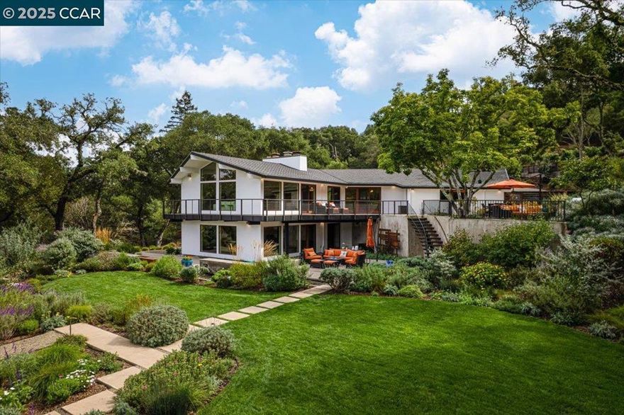 Mid-century modern meets contemporary with this stunning 5 bedroom, 4 bathroom home complete with floor-to-ceiling windows and open floor-plan. The 1.3 acre estate features an oversized-lawn, bocce court, modern fountain, outdoor kitchen, firepit and a mini-Filoli Garden with meandering paths filled with plants that bloom year-round! The remodeled kitchen has cathedral ceilings, a walk-in pantry, large island, Sub-Zero refrigerator and separate full-sized Sub-Zero freezer. Two bedrooms and bathrooms are on the main level (including primary suite), with 3 more bedrooms and a family room downstairs. There's even a separate air-conditioned studio in the yard. The 2-car garage is oversized with several other areas to park on the property at the end of a private cul-de-sac.