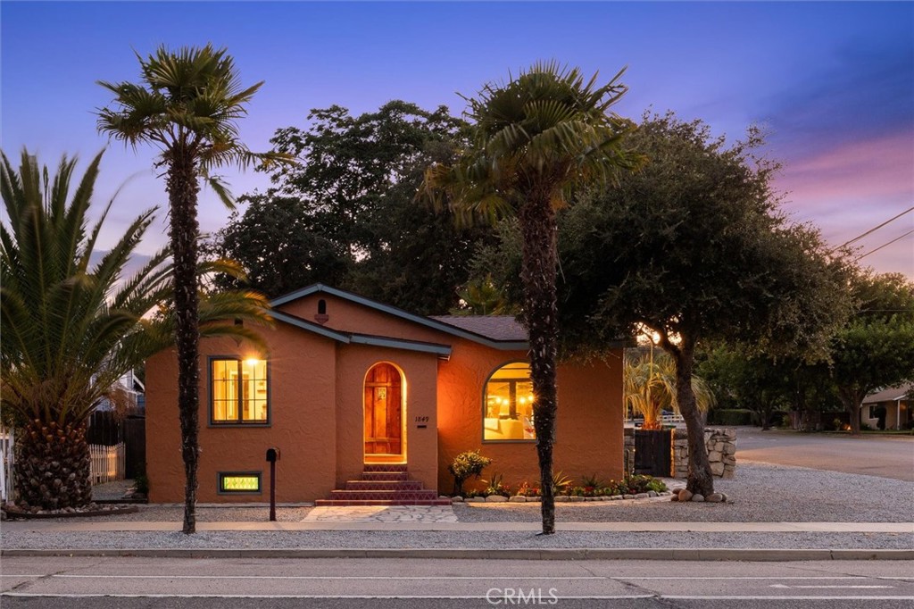 Are you seeking artistic energy, income potential, or multi-generational comfort? This property has it all. Two homes, 1849 Vine Street and 428 19th Street with additional guest space all on one prime corner lot near downtown Paso Robles. Located just a block from the Paso Market Walk and minutes to the hub of downtown you will not find a more idyllic location. The primary home has more than just curb appeal. This classic Spanish bungalow built in 1935 has a captivating vibe and energy that welcomes you in. It has three bedrooms and a bathroom on the living level plus a finished room and half bathroom in the basement. Many updates and modern conveniences have been added over the years but the most important historic details remain - solid carved wood door, arched picture window, arched book niches, and wood floors with the perfect patina. Opposite the car port is the original carriage house which has been converted without permits into an efficient and charming studio. At the far corner of the lot is a stand alone one bedroom cottage complete with a bathroom and laundry room. The cottage has its own address and utilities. Each home has their own private patio to enjoy the fresh Paso air under the shade of iconic oak trees. You have to see it for yourself to appreciate the immaculate condition and creative details. Some recent improvements include a new roof, new electric panel, fresh exterior paint, several new windows in the main house.