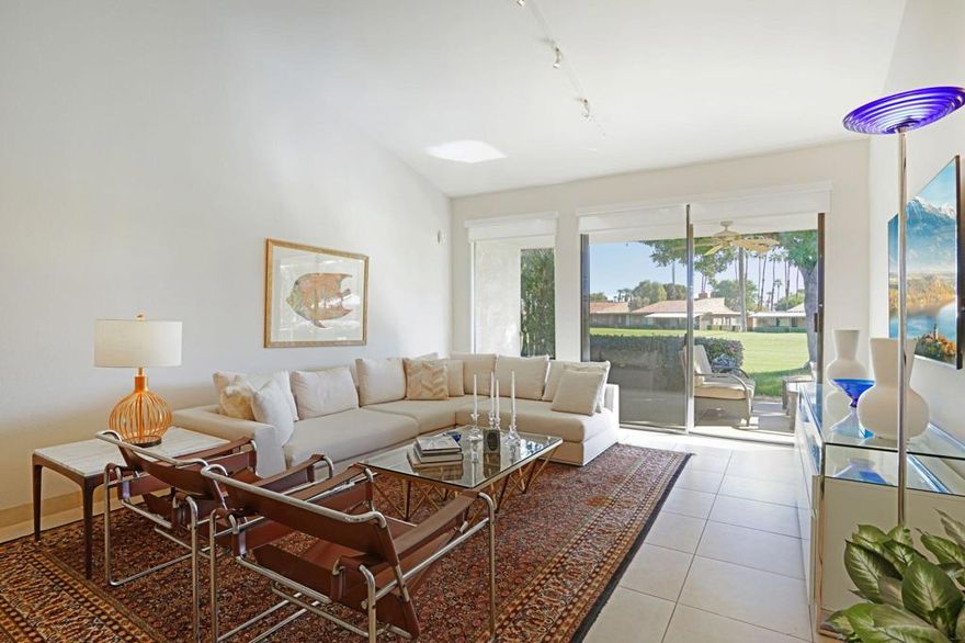 Welcome to one of the crown jewels of Sunrise Country Club! This stunning condo isn't just beautiful and spacious, it comes with true STAR POWER. Having once belonged to the iconic CAROL CHANNING and where her memoirs were written, this home carries a touch of Hollywood history and charm. If she loved it... you will absolutely fall in love too! Step inside this light, bright, and updated Granada floor plan (2 bedrooms, 2 bathrooms, nearly 1,400 sq. ft.) and soak in the gorgeous fairway and mountain views that set the tone for relaxed resort living. As you approach the property, you're welcomed by a warm and beautifully landscaped front courtyard, an ideal spot for morning coffee or unwinding by the fire with your favorite evening drink. Through the stylish French doors, the home opens into an elegant living space that immediately brings a feeling of peace and sophistication. The upgraded kitchen shines with beautiful granite slab countertops, a chic glass tile backsplash, custom wood cabinetry, stainless steel appliances, a large picture window over the patio, and plenty of counter space for cooking or entertaining. The living room is equally impressive, featuring a dramatic wall of glass overlooking the fairway, soaring cathedral ceilings that is unique to only a few condos, and a lovely dining area perfect for gatherings with friends and family. The primary suite is a true retreat, complete with serene mountain views from the bed, direct access to the oversized back patio, a beautifully updated bathroom with a seamless glass walk-in shower, spacious vanity, and a huge custom walk-in closet. The guest bedroom offers wonderful separation from the rest of the home, sliding glass door to the front patio, a built-in desk area, and access to the stylish guest bath, giving it an en-suite feel your visitors will love. Throughout the home, you'll find thoughtful upgrades like custom shades for privacy and energy efficiency, newer HVAC and water heater systems, and updated glass in the sliding doors and the list continues giving you a turnkey, move-in-ready home from day one. Sunrise CC is a lively, welcoming community offering golf, tennis, a fitness center, and an exceptional dining experience thanks to their new premier chef crafting delicious meals for residents. You won't want to miss this opportunity,  come experience this special home for yourself!