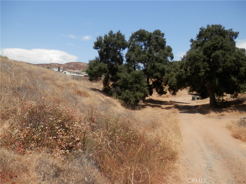 Exciting new listing! Offering a collection of 3 contiguous lots in the growing city of Wildomar, in Riverside County. Located north of the 15 Freeway and Cottonwood Acacia St., Power is nearby the topography varies from flat to gently rolling, offering scenic views and flexible development potential. Short drive to I-15, I-215, and Hwy 74, Proximity to Loma Linda University Medical Center, Mt. San Jacinto College, shopping centers, and schools. Located near Canyon Lake, Menifee, and Lake Elsinore. Whether you’re looking to develop one home or invest in multiple parcels, this is an excellent opportunity in one of Southern California’s fastest-growing regions. Enjoy privacy, convenience, and beautiful surroundings, not quite off the grid, but close to nature. Buyer to verify land use and development potential with the City of Wildomar Planning Department. APN: 361-051-015; 361-051-016; 361-051-017. Size: +/- 22,000 S.F; Zoning: RR; Terrain: Flat to rolling; GPS: 33.655138, -117.235228 (S.W Corner)