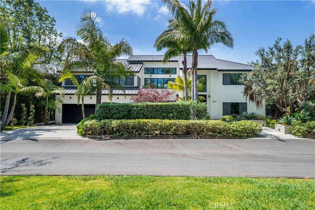 Welcome to 13524 D Este Drive! An Unparalleled Luxury Resort-Style Living Experience in Palisades Riviera. This breathtaking 6,320 sq ft modern masterpiece in the coveted Palisades Riviera offers a truly unique lifestyle — one of ultimate luxury living, wrapped in privacy and tranquility. Designed with an open, flowing floor plan and flooded with natural light from expansive floor to ceiling windows, the home effortlessly connects indoor and outdoor living. Fully retractable pocket sliding glass doors in the living and family rooms dissolve boundaries, inviting you into the stunning tropical backyard, a private paradise reminiscent of a high-end Hawaiian resort. The backyard is an artistically crafted oasis featuring lush tropical landscaping, a serene pond, a custom fire pit, a sparkling pool and Jacuzzi, a detached pool house, and a full outdoor BBQ with a custom pizza oven. The spacious deck and heated patios provide perfect spots to relax or entertain year-round in this tranquil, resort-like setting. Photos cannot capture the true magic. This is a place that must be experienced in person to be fully appreciated! Inside, the home boasts 6 bedrooms and 6.5 bathrooms, all finished with the highest quality European cabinetry, doors, windows and finishes. The gourmet kitchen features premium Miele appliances, while the living and family rooms are warmed by a modern two-sided fireplace that creates a cozy yet sophisticated atmosphere. The smart home system with built-in speakers offers seamless control throughout, blending cutting-edge technology with timeless design. The grand entryway will leave you speechless. Soaring double-height ceilings and abundant natural light set the tone for a home that feels calm, serene, and incredibly private. Featured in a renowned architectural magazine, this home is a testament to exceptional design and craftsmanship. From the moment you arrive, you know this is not just a residence — it’s a lifestyle defined by luxury, privacy, and architectural brilliance. Complete with a 3-car garage and a versatile additional room perfect for an office or studio with acoustic walls, this home stands apart in design, location, and amenities. Just moments from The Riviera Country Club, Brentwood Country Mart, and top-tier dining and schools, this estate is a rare gem in one of Los Angeles’ most sought-after neighborhoods.
