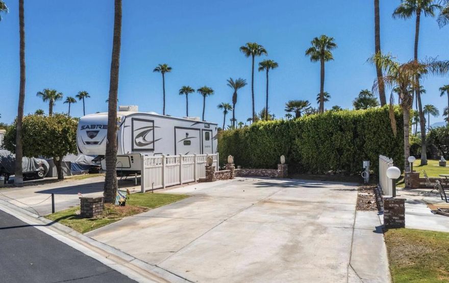 OT ONLY. Located near the La Palma Clubhouse and resort entry/exit, this lot offers unparalleled convenience. With mature hedging to the rear for added privacy, this lot has been extended to provide ample outdoor living space. Outdoor Resorts Palm Springs is a guard gated resort that sits on 137 beautifully landscaped acres with 27 holes of executive golf, 10 tennis courts, 13 pickleball courts, 8 swimming pools, a fully equipped fitness center, beauty salon/barber shop, full-service restaurant, convenience store, two club houses, activities, special events and so much more.