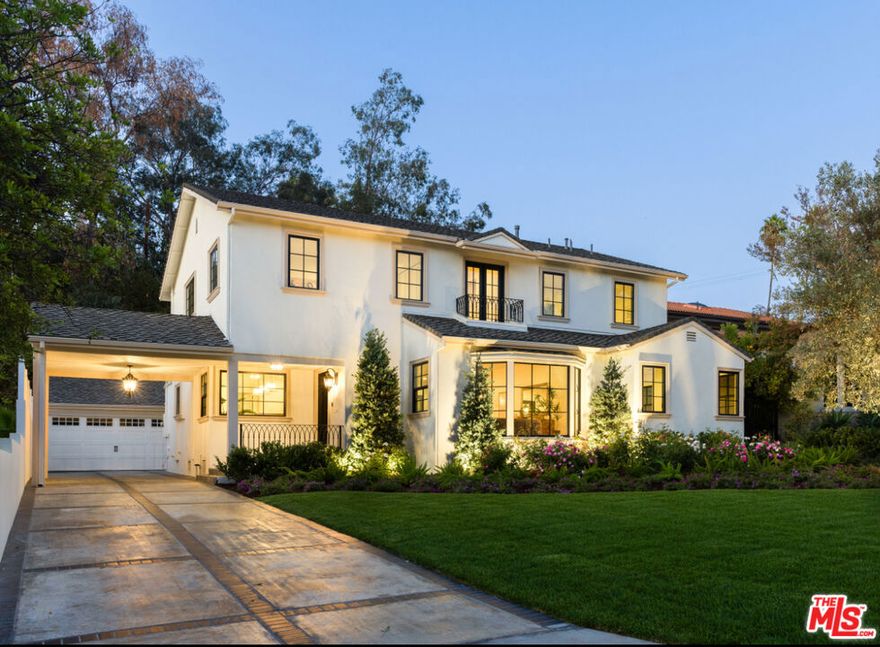 On the prestigious Hill Drive in Eagle Rock, sited on the north side of the street on a large lot, sits this majestic two-story, newly refurbished Cape Cod influenced Colonial Revival masterpiece. Pride of ownership shines throughout this five-bedroom, five-bathroom home. As you descend the driveway, take in the lush, beautifully landscaped front yard with custom uplighting. Park beneath the porte-cochere and step into a grand, light-filled living room featuring high ceilings, new wideplank flooring and a large picture window overlooking Hill Drive. Enjoy the open flow from the living room to the dining area and into the open-concept cook's kitchen, complete with a Bertazzoni stove, Fisher Paykel refrigerator, soft-close drawers, and a convenient laundry room connected to the kitchen with LG washer/dryer. Double doors from the main living area lead to a large, private grassy backyard with a sparkling pool, sundeck, and inviting hot tub all completely redone for effortless entertaining and relaxation. Downstairs, a spacious, light-filled bedroom with a bespoke bathroom offers the perfect retreat for guests or extended family. Upstairs, the grand staircase leads to four additional bedrooms and three bathrooms, ideal for a growing family where everyone wants their own space. The primary suite features dual closets and a beautifully designed bath. Across the hall is another ensuite bedroom, while two luminous front bedrooms share a full bathroom. This home has been remodeled from top to bottom with no expense spared and expert craftsmanship throughout including new all new Milgard windows and doors. The finished garage provides a versatile bonus space perfect for an office, studio, or media room. A true diamond in the necklace of Hill Drive. A rare blend of Style, Space and Sophistication.