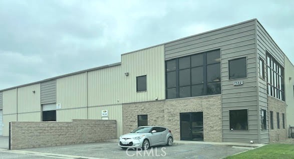 Prime Identity location, Freestanding Industrial building with Offices(4) wet bar, restrooms(2) and mezzanine, Large Fenced yard, No association Fees