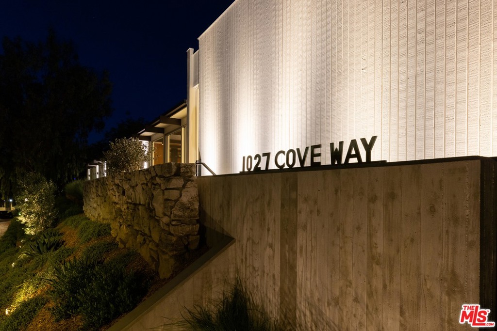 A meticulous and sophisticated restoration and transformation of a single story 1957 mid-century, originally designed by Alfred T. Wilkes, on one of the most prime streets in Beverly Hills. The level of detail and quality of materials is unparalleled. Gated with a high-level surveillance system, this 4 bedroom, 6 bathroom home has beautiful terrazzo floors with brass inlay throughout, sliding doors that create a true indoor/outdoor flow, stunning entertaining spaces, walnut paneling, teak ceilings, and a custom kitchen with high-end appliances. This is a unique and distinct example of retaining the original lines and architectural integrity of a home while also incorporating the latest technology and finishes beloved in 2021. The epitome of warmth, luxury, and style in an ultra-prestigious location.