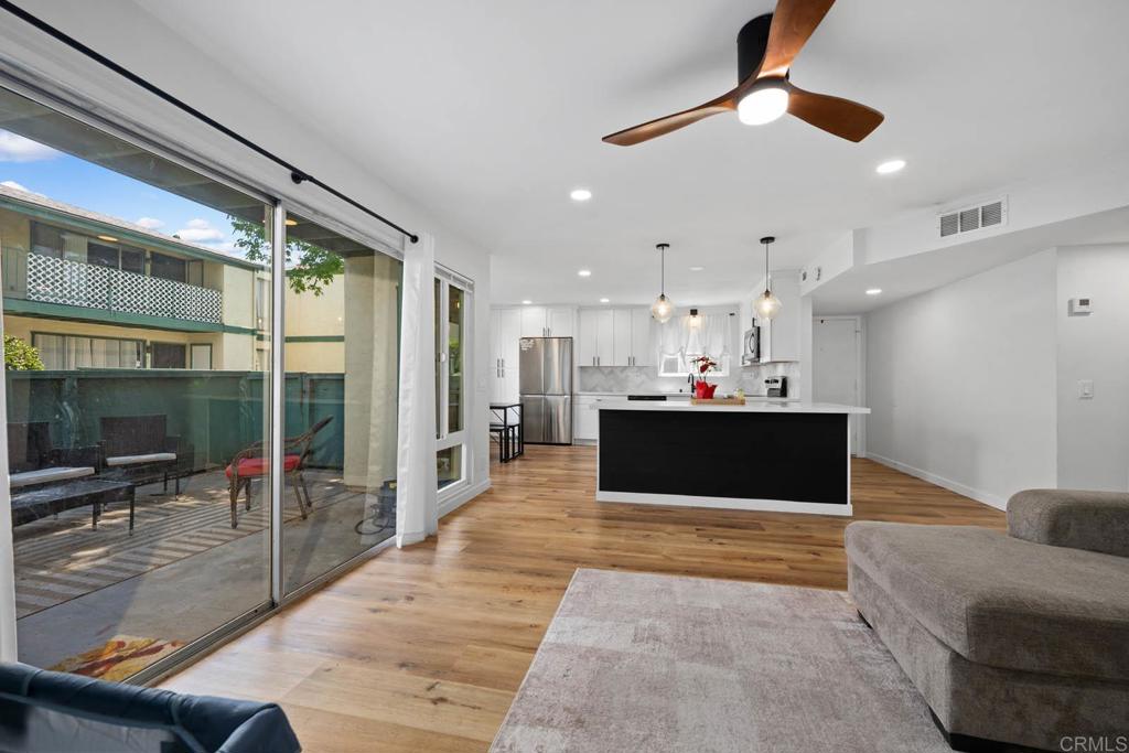 This beautifully renovated bottom-level corner unit offers 3 spacious bedrooms and 2 updated bathrooms, providing a comfortable and modern living space. The kitchen boasts shaker cabinets, elegant quartz countertops, and a farmhouse sink, creating a functional and inviting space for cooking and entertaining. Wood-like luxury vinyl plank flooring throughout combines the warmth of wood with easy maintenance ideal for busy lifestyles. The open-concept design maximizes living space, providing flexibility for various furniture arrangements and personal touches. Both bathrooms have been thoughtfully updated, offering contemporary fixtures and finishes. Situated in a desirable community, close to shopping, dining, and public transportation, making daily errands and commuting a breeze. This move-in-ready home offers a harmonious blend of modern upgrades and cozy living, making it an excellent choice for first-time homebuyers. Don't miss the opportunity to make this exquisite property your new home.