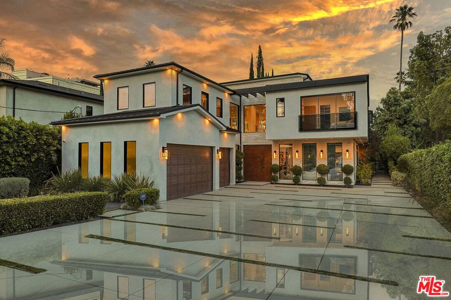 Discover a world of luxury in this modern estate, designed with exceptional attention to detail and a focus on privacy and high-end amenities. Beyond a private gated entrance, this architectural gem unfolds into an oasis of warmth, sophistication, and comfort perfect for those who value both intimate gatherings and grand entertaining. The heart of this home is its expansive gourmet kitchen and great room, inviting everyone to gather around the oversized island while enjoying panoramic views of the lush backyard. Sunlight streams through 30-foot glass patio doors, seamlessly blending indoor and outdoor spaces to create an airy, light-filled environment ideal for a modern, luxurious lifestyle. The formal dining room, complete with a butler's pantry, enhances the home's entertaining capabilities, while the adjacent movie theater, paired with a private bar and wine cellar, offers an exclusive, in-home entertainment experience. A private home office looks out onto the beautifully landscaped yard, providing a serene backdrop for productivity. The owner's suite is a haven of luxury, featuring boutique-style glass-front closets and a primary bathroom that feels like a private spa retreat, with its double patios and elegantly designed details.Upstairs, five additional ensuite bedrooms and a versatile loft area ensure comfort and privacy for family or guests. Outside, this property is an entertainer's dream: a zero-edge pool shimmers under the sun, while a cabana with a full bath and an outdoor kitchen with BBQ offer the perfect setting for gatherings. The outdoor space is completed with a half-court basketball area, all shielded behind privacy hedges and secure gates. This is more than a home; it's a private retreat where every detail is designed to elevate your lifestyle.