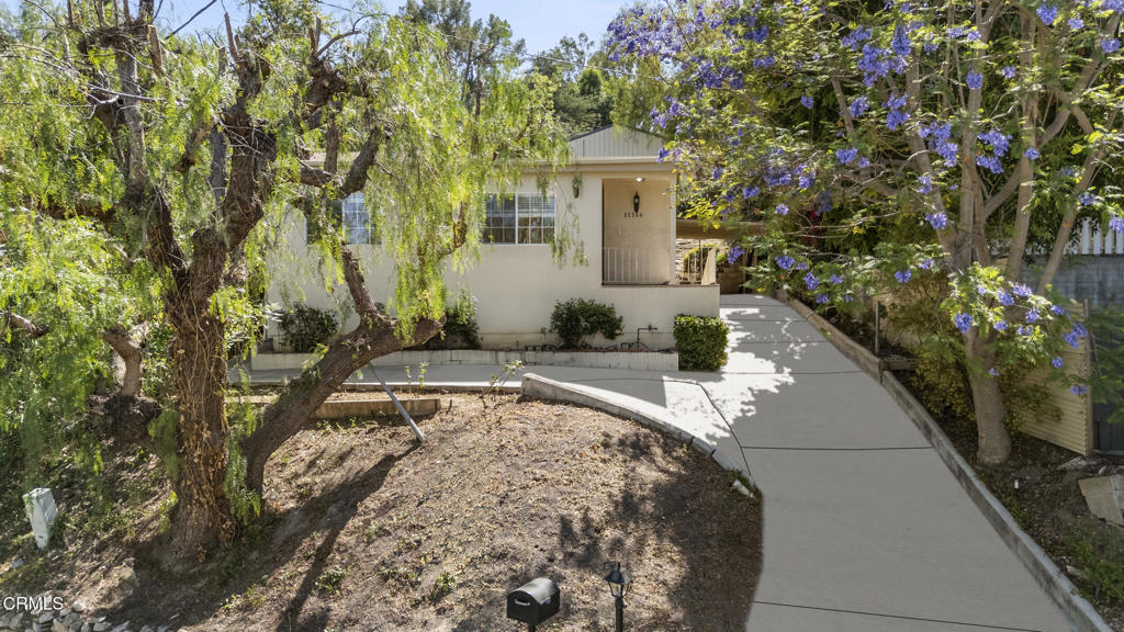 This Woodland Hills property is located South of the Boulevard and features 3 bedrooms, 2.5 bathrooms, an open floor plan and light-filled interiors. Enter into a bright formal living room which flows seamlessly into a large, open kitchen, overlooking the family room. Three spacious bedrooms, newly carpeted floors, recessed lighting throughout, appliances included (refrigerator, dishwasher, stove, stacked washer/dryer, microwave), central AC/heat. The long driveway offers plenty of parking including a detached covered carport and a concrete pad in front of the home. Conveniently located minutes away from Topanga Village, Whole Foods, Westfield Topanga, and much more.