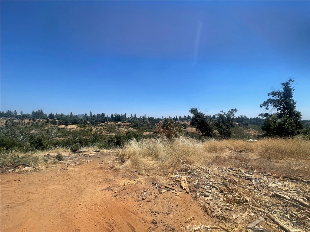 This expansive 2.37-acre lot offers stunning canyon and sunrise views, creating the perfect backdrop for your dream home or private retreat. With an active PID water account already in place, the property is ready for development. Surrounded by mature trees and abundant wildlife, it provides a rare combination of privacy, natural beauty, and convenience. The gently sloping terrain opens up to endless views of untouched nature, making this a truly special opportunity for anyone seeking space, serenity, and inspiration.