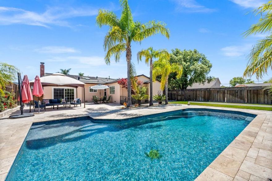 Immaculate and gorgeous home is flush with character and has no detail left unturned. This is a rare corner house on a big, spacious lot. Check out the entertainer's dream backyard with a huge patio, lush landscaping, a custom designed pool with a Shamu shelf and fountains, all surrounded by a palm tree oasis-like setting! Inside, you will find a Chefs kitchen with stainless steel appliances, cherry cabinets, and open floor plan. Newly remodeled master bath, new driveway, new crown molding, and so much more. Fully owned solar panels  both for the house and pool! Ownership took pride in ongoing maintenance and meticulous upkeep with all water piping changed, HVAC replaced, new subpanel added. Enjoy the convenient location in the beautiful Miner Park neighborhood with easy access to park, shopping, and major freeways.