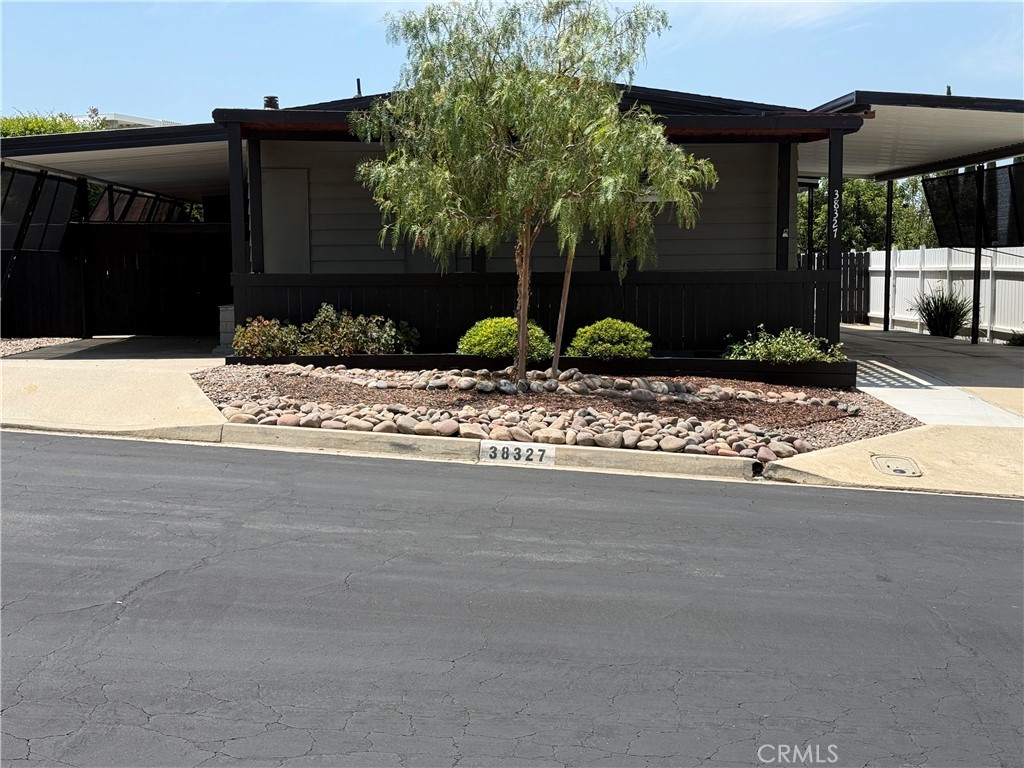 WELCOME TO 55+ LIVING IN MURRIETA HOT SPRINGS MFG. COMMUNITY AKA "THE KNOLLS". OWN THE LAND THAT YOUR HOME SITS ON!
HOMEOWNERS ASSOCIATION HAS PEACEFUL FEELING, FRIENDLY PEOPLE, LOTS OF ACTIVITIES, POOL, EXERCISE, LIBRARY AND MUCH MORE FOR A LOW HOA.THIS 2 BEDROOM,2 BATH MFG. HOME IS READY FOR YOU TO MOVE YOUR PERSONAL ITEMS IN, CLEAN AND COMFORTABLE. 1615 SQUARE FEET WITH A NICE LIVING AREA WITH DINING ROOM WITH A BUILT IN HUTCH TO ENJOY YOUR CHINA, PICTURES, KNICK KNACKS, ETC. VINYL FLOORS MAKE IT EASY TO CLEAN. IN ADDITION TO THIS AREA IS LARGE ATTACHED ROOM THAT COULD BE USED FOR SEWING ROOM, READING ROOM, CRAFT ROOM OR A PLAYROOM FOR THOSE GRANDKIDS! SLIDING GLASS DOOR WILL LEAD YOU OUT TO A LOVELY BACKYARD WITH AN AMAZING VIEW AND A COVERED PATIO TO ENJOY IT ON. DUAL PANE WINDOWS HAVE BEEN ADDED FOR ADDITIONAL COMFORT. KITCHEN AND DINETTE AREA WITH A CUTE STORAGE/SHELF. PRIMARY BEDROOM HAS 2 CLOSETS INCLUDING A WALK IN CLOSET. SECONDARY BEDROOM HAS A WALK IN SHOWER. GOOD SIZE LAUNDRY ROOM WITH PLENTY OF STORAGE. EXTERIOR OF HOME HAS RV ACCESS AND ADDITIONAL PARKING ON BOTH SIDES OF THIS BEAUTIFUL HOME. NEW A/C, FABULOUS WORK ROOM WITH SHELVING AND ELECTRICITY AND A SEPARATE SHED FOR YOUR GARDENING TOOLS, PAINT, ETC. THIS HOME ALSO BOASTS OF A GREAT AREA FOR PLANTING YOUR GARDEN AND YOU WILL NOT BELIEVE THE VIEW FROM THIS HOME. COZY COVERED PATIO TO ENJOY VIEW, COFFEE, COCKTAILS OR JUST SOME SERENE AND RELAXING TIME THAT WE ALL NEED. LOW MAINTENANCE YARDS WITH PLENTY OF PRIVACY. SELLER IS MOTIVATED. PLEASE LOCK/UNLOCK THE DEADBOLTS ONLY AND TURN LIGHTS OFF. THANK YOU FOR SHOWING. SEE AGENT REMARKS.