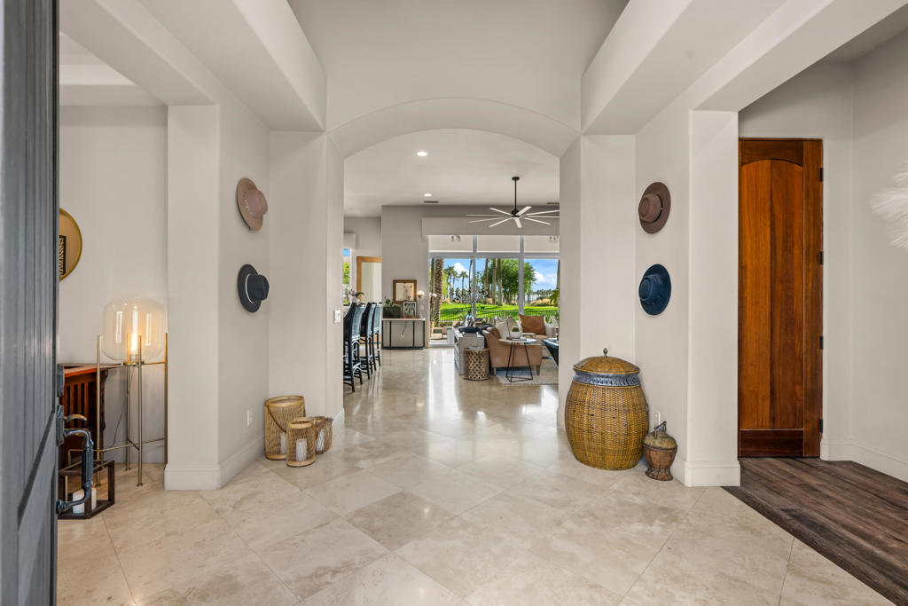 Discover timeless elegance in this exquisite residence in the Palms Country Club in La Quinta. Spanning 2883 sq ft., this 3 bdrm ( plus den/office ) with ensuite bathrooms offers a luxurious blend of indoor - outdoor living - perfect for the discerning vacationers! As you near the property, you are greeted by a serene landscaped courtyard - a prelude to the elegance within. Enter the expansive living area featuring coherent integration of comfort and style. The impressive kitchen features tall cabinetry, sleek stainless appliances and quartz countertops complemented by a chic bar for casual gatherings. The seperate office and den provides a refined space for work or relaxation. The flow from the great room to the back patio is the epitome of seamless transition towards an outdoor space with the pool, spa, bbq and fire pit - all of which are ideal for enjoying the expansive golf course views! The primary bedroom has a King bed complete with ensuite tub while the guest room has a qeen bed. The large detached casita features a seperate entrance with a king bed for ultimate comfort and privacy! Now booking for the 2025/2026 season!