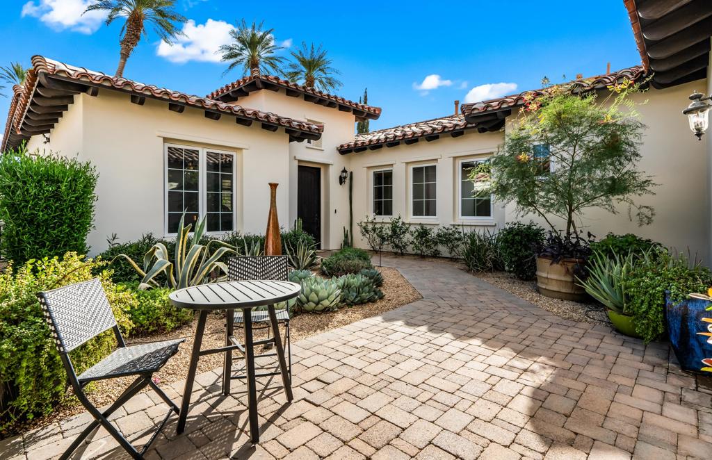 Tucked behind the gates of the exclusive Palms Golf Club, this single-level transitional Spanish villa sits proudly on the 10th tee box -- a front-row seat to the desert's most coveted views. Designed with soul and intention, every inch of this 3-bedroom + den/office retreat has been curated for the discerning guest who values beauty, privacy, and connection.Step through the private courtyard and into a home where light, texture, and clean lines bring timeless warmth to modern living. Vaulted ceilings, hand-selected furnishings, and natural materials create a seamless blend of California casual and European-inspired elegance. The heart of the home -- a chef's kitchen with quartz counters, stainless appliances, and a custom bar -- opens to a sunlit great room, where oversized glass doors lead to the show-stopping backyard.Outdoors, life unfolds around the pool, spa, and rustic-modern fire feature. Host alfresco dinners under the stars in the outdoor kitchen and dining pavilion, unwind in the spa after a round of golf, or gather for golden hour cocktails as the sun melts over the fairway. Every space is built for celebration, conversation, and restoration.The primary suite offers a tranquil escape with a king bed, soaking tub, and serene views. A private guest room with queen bed ensures comfort for visitors, while the detached casita -- with its own entrance and king bed -- offers a luxury stay all its own.This is not just a home -- it's a destination. A place where mornings begin slowly, afternoons are meant for play, and every evening invites connection. Now booking for the 2025/2026 season.'