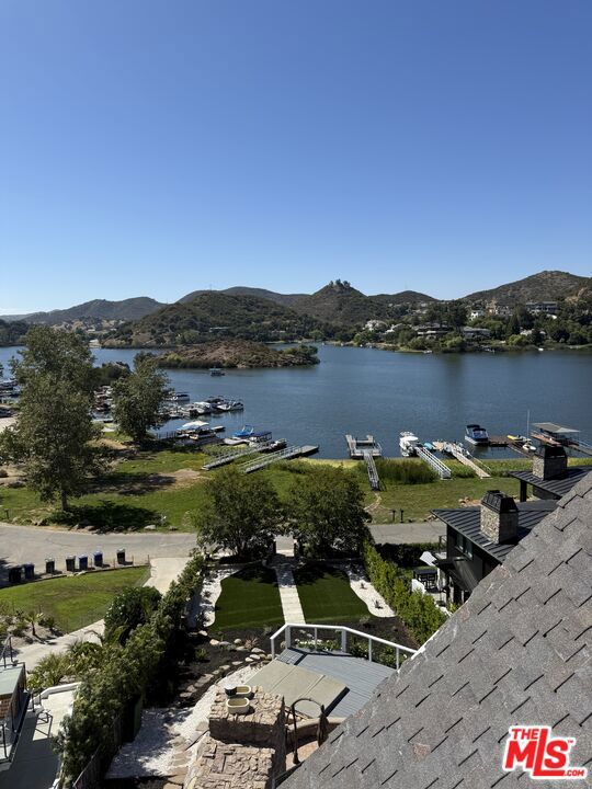 Here's Your Chance to acquire a premiere Lake Property that you can make your own! Incredible Opportunity! Upside Potential! The View is Perfection! Completely unobstructed like a postcard! This Unique and stylish residence is situated within the Main Gates of The Exclusive Guard-Gated Lake Sherwood Community, one of only 19 homes within the gates "on the lake," in the Southshore original community it also includes its own private dock. The home provides breathtaking views from every level, 4 bedrooms, and a bonus room. Just over 3000 square feet with multiple outdoor patio areas and a terraced deck featuring two outdoor fireplaces. The kitchen is equipped with stainless steel appliances, a Wolf range, and center island a breakfast bar. Enhancing lake lifestyle, the property boasts outdoor prep kitchen, a gourmet-fired pizza oven, a gas grill, a spa, a custom waterfall, and a spacious lawn. The entire lower-level functions as a large primary suite and spa like bath overlooking the beautiful tranquil lake. Located within the main gates of the exclusive Sherwood Country Club which offers a World Class, Championship Golf course, Tennis Courts, Pool, fitness amenities, dining and more! Live the vacation year-round lifestyle! Kayaks, boats fishing, Dining and more! Blue Ribbon schools nearby both public and private. Tons of upside potential for this home with expansive lot, with dock bring your own taste and create YOUR dream come true!