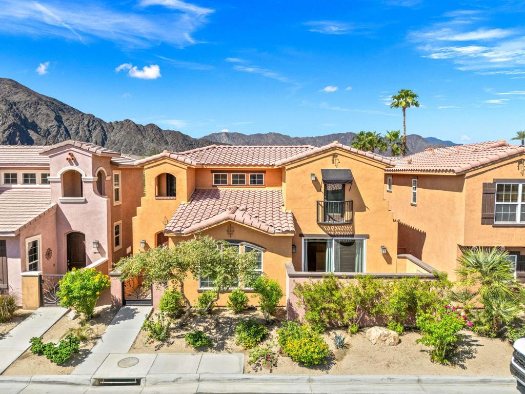 Welcome to 52161 Rosewood Lane, the best home under $500K in La Quinta! This 3 bed, 2.5 bath residence offers soaring high ceilings and walls of windows that fill the open-concept floor plan with natural light. The spacious living area features a surround sound entertainment system and flows effortlessly into the dining area and kitchen with granite counters, pantry, and abundant storage. From the dining area, sliding doors open to a private patio, creating a seamless connection for year-round indoor/outdoor living. Upstairs, the primary suite showcases mountain views, a private patio, walk-in closet, and an ensuite bath with a recently remodeled shower. Two guest bedrooms--one with sweeping mountain views and the other with a Juliette balcony--are paired with a full bathroom to comfortably accommodate family and friends. With an attached 2-car garage and excellent rental potential, this home is move-in ready. The gated community welcomes you with meticulously maintained landscaping and a true resort-style lifestyle: pool with cabanas, spa, barbecue lounge area, fitness center, tennis court, and scenic walking paths with pet-friendly areas. Don't miss this incredible opportunity--schedule your private viewing today!