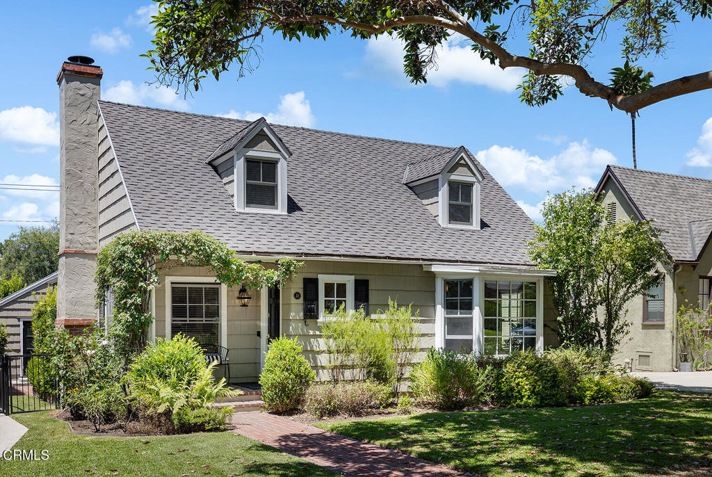 Welcome to this beautifully updated Cape Cod-style home, ideally nestled in the ever-popular San Rafael Flats--one of Pasadena's most sought-after neighborhoods known for its charm, tree-lined streets, and proximity to parks, cafes, and Old Town. Designed with a modern lifestyle in mind, this home features a bright, open-concept layout that seamlessly connects the kitchen, dining, and living areas. At its heart is a stunning chef's kitchen, complete with top-tier stainless steel appliances, a Wolf range, custom cabinetry, a spacious center island with prep sink and microwave, and designer tile and countertops that bring both beauty and function. The main-level primary suite offers a peaceful retreat with a spa-like bath, dual vanities, and a generous walk-in closet with built-ins. A second downstairs bedroom and elegant hall bath provide comfort and flexibility for guests or family. Upstairs, a vaulted-ceiling bedroom is accompanied by a cozy sitting room or office and a full bath, creating a perfect space for privacy, creativity, or relaxation. All this just moments from Little Flower Cafe, Old Town Pasadena, and nearby parks--an exceptional home in a location that perfectly balances tranquility and convenience.
