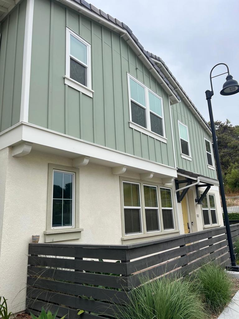 The beach is less than a mile from home! Enjoy added privacy w/ this END Unit 2 story town-home 3 bed+loft featuring wrap around patio w/greenbelt views from master b/b, dining & kitchen. Lots of windows provide natural lighting. Master has wonderful ensuite bathroom plus 2 walk-in closets. Kitchen features Stainless Appliances, Granite counters, white cabinets and large pantry. Custom neutral paint, tile & carpet flooring. Energy efficient appliances & solar panels. West of 5! The premium location sits high up the hill with easy walk to the community pool. Close to shopping, freeways and the beach!