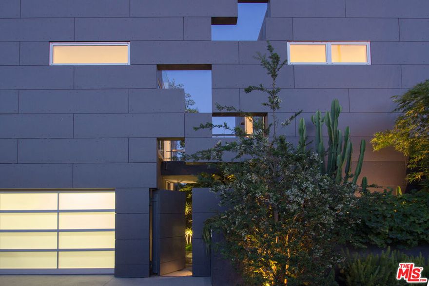 Experience the bold design of this modern compound moments from the epicenter of Venice. Minimalist architecture defines this home with open living plan and custom Bulthaup kitchen. Walls of glass merge the indoors and out, taking full advantage of the sun & sea breezes. A floating steel-and-walnut stair beckons you to an expansive rooftop deck - complete with fireplace, kitchen, hot tub and lounge areas. Exquisite master suite is simple & elegant, with custom his & hers closets, glass-panel steam shower and freestanding soaking tub with lush views of the landscape and sky. A terrarium courtyard splits the two distinct structures on the property, with an overhead bridge joining the buildings. High ceilings, abundant natural light, refined in detail and finish, this dynamic environment offers complete privacy in the heart of Venice. Architecture by SEA; Interiors Chris Rossi Design; Martha Mulholland; Landscape Jack Price Design. Available February 1, 2026