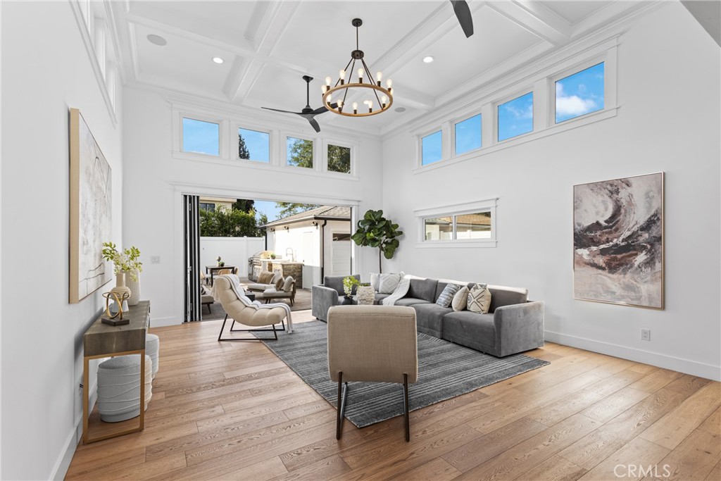 Tucked away on a quiet cul-de-sac in prime Sherman Oaks, this move-in ready home has been tastefully updated inside and out. Natural light floods the open-concept floor plan, highlighting the charming details and timeless character found throughout. At the heart of the home lies the designer chef’s kitchen, equipped with premium stainless-steel appliances, quartz countertops and a built-in breakfast nook. Open to the kitchen, there’s a formal dining room and spacious family room that boasts lofty 14ft ceiling and a Panoramic Door that seamlessly extends your living space into the backyard. Step outside to your private retreat, where you’ll find an oversized spa with a cascading waterfall flowing into the heated pool, a fully equipped summer kitchen, outdoor shower and ample patio space for relaxing or enjoying an al fresco meal. This home offers four generously sized bedrooms and three full bathrooms, including a luxurious primary suite that features a custom built-in closet and spa-inspired bathroom, complete with a soaking tub, large glass-enclosed shower and double vanity. Additional highlights include a formal living room with a cozy fireplace, dedicated laundry room, security system, smart home features (built-in speakers, Nest thermostat, etc.) and a finished detached two-car garage. This property is conveniently located just moments from Westfield Fashion Square, Ventura Boulevard’s vibrant shopping and dining scene, and top-rated public/private schools.