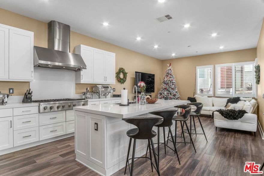 This stunning, Fully Furnished three-story home is the perfect blend of style and functionality, with great living space and plenty of entertainment areas for guests. The first floor boasts a modern gourmet kitchen with top-of-the-line appliances, custom cabinets, and quartz countertops, perfect for cooking up a storm while guests sit at the huge island. The entire home can be set up as a smart home . Can be set up to be controlled from your fingertips, making everything from the lighting to the temperature a breeze to manage. The first floor also features a bedroom with a full bathroom, an ideal in-law suite or guest room. Head up to the second level and you'll find the living quarters, including an oversized primary suite with its own private patio and stunning views. The large bathroom has dual sinks , a walk-in closet, and a stand-up tile shower. The entire level is equipped with smart lighting and fans for added convenience. The real showstopper, however, is the private living room on the third floor, complete with a full bar and an extended patio that offers views of the surrounding area. Enjoy sunsets and sunrises while sipping on your favorite wine from the built-in wine fridge. The space is perfect for entertaining guests or just relaxing with friends. The community itself is environmentally friendly, with multiple charging stations and a community garden that harvests every Tuesday in the summer. There are also three pools, playgrounds, paseos, and parks, making it the perfect combination for activities and frolic. Don't miss out on the opportunity to make this stunning home your own. The solar is paid off and the property has 2 AC units. This community is located in the up and coming Five Points area, it will not disappoint in design, location, or amenities.