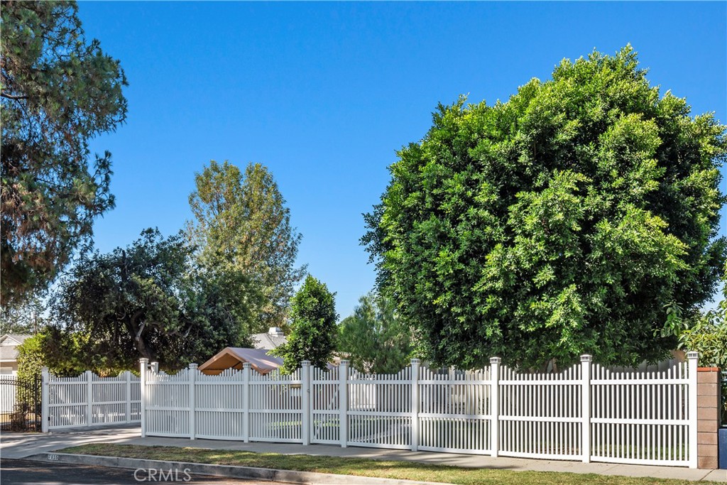 Nestled behind a private automatic gate, this beautifully upgraded 3-bedroom, 2-bathroom home offers style, comfort, and functionality. The modern kitchen boasts quality upgrades, while the dedicated laundry room adds everyday convenience. Enjoy an expansive enclosed patio—perfect for entertaining on warm summer nights. The large, manicured grassy yard features mature fruit trees, creating a lush retreat. An oversized shed with electrical and air conditioning provides endless possibilities for a workshop, studio, or extra storage. A true blend of privacy, charm, and thoughtful amenities—ready for you to call home.