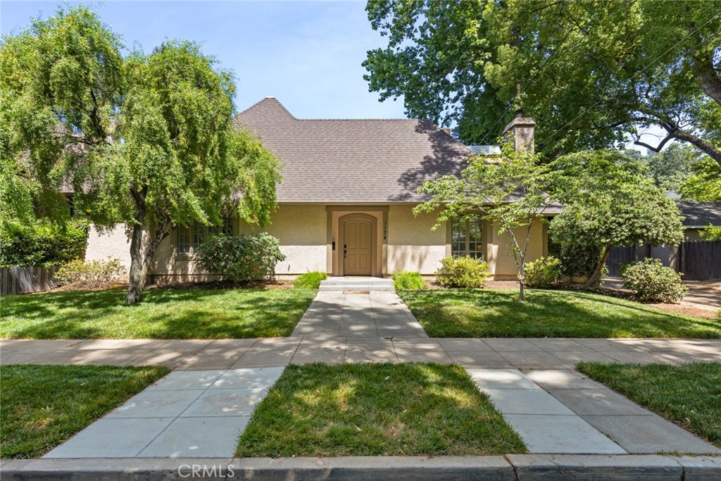 Just a block from Bidwell Park’s iconic One Mile Recreation Area, this gem is located in Chico’s highly sought-after Golden Triangle. Blending classic neighborhood charm with modern flexibility, this custom home features vaulted ceilings, skylights, wood-framed windows, a grand fireplace, and French doors that open to a private brick patio and deck with spa. The main floor offers a spacious bedroom and full bath ideal as a guest suite, office, or den. Upstairs, two bright bedrooms each have their own bathrooms, providing comfort and privacy. A detached studio above the garage includes a private entrance, kitchenette, and full bath—perfect for in-laws, guests, a home office, or rental income potential. The home is being sold furnished, offering a truly move-in ready opportunity—whether for personal use, short-term stays, or long-term rental. Access to the attached two-car garage and private studio entrance is tucked within a shared motor courtyard, adding convenience to this low-maintenance property just steps from Caper Acres, Bidwell Park trails, and all the best of Chico living.