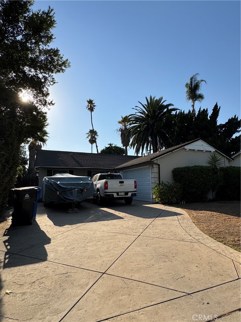 Charming 3+1.5 bath home on a quiet street in Van Nuys. Hardwood flooring throughout, cozy LR w/fireplace & spacious kitchen w/breakfast area. Cozy den/office with high ceilings. Backyard is perfect for entertaining w/covered patio, grassy area & pool! Sold in "as is" condition.