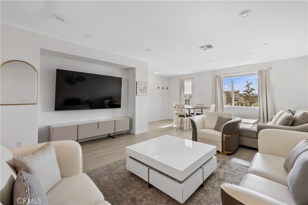 Welcome to your personal "SANCTUARY" at 27579 Sanctuary Ct, Valencia!
This turn-key, top-of-the-line home offers a spacious three-level layout perfect for modern living and entertaining. On the first level, enjoy a private bedroom with an attached bath, ideal for an in-law suite or guest room. Ascend to the second level, where you will find a stunning kitchen and family room with breathtaking views in a prime location within this beautiful community. The kitchen is a chef's dream, featuring high-end appliances, energy saving upgrades, LED lighting, and fully paid-off solar. The third level hosts a second bedroom with full bath, plus an expansive primary suite with a luxurious spa tub, dual sinks, a connecting shower, and a walk-in closet, the ultimate retreat! You'll absolutely love the high ceilings, recessed lighting, beautiful hardwood floors throughout, and a spacious two-car garage. Enjoy resort-style living with a clubhouse, multiple pools, spa, playgrounds, barbecue areas, and scenic walking trails. Every detail has been thoughtfully designed for comfort, style, and effortless living. YOUR PERFECT SANCTUARY AWAITS!