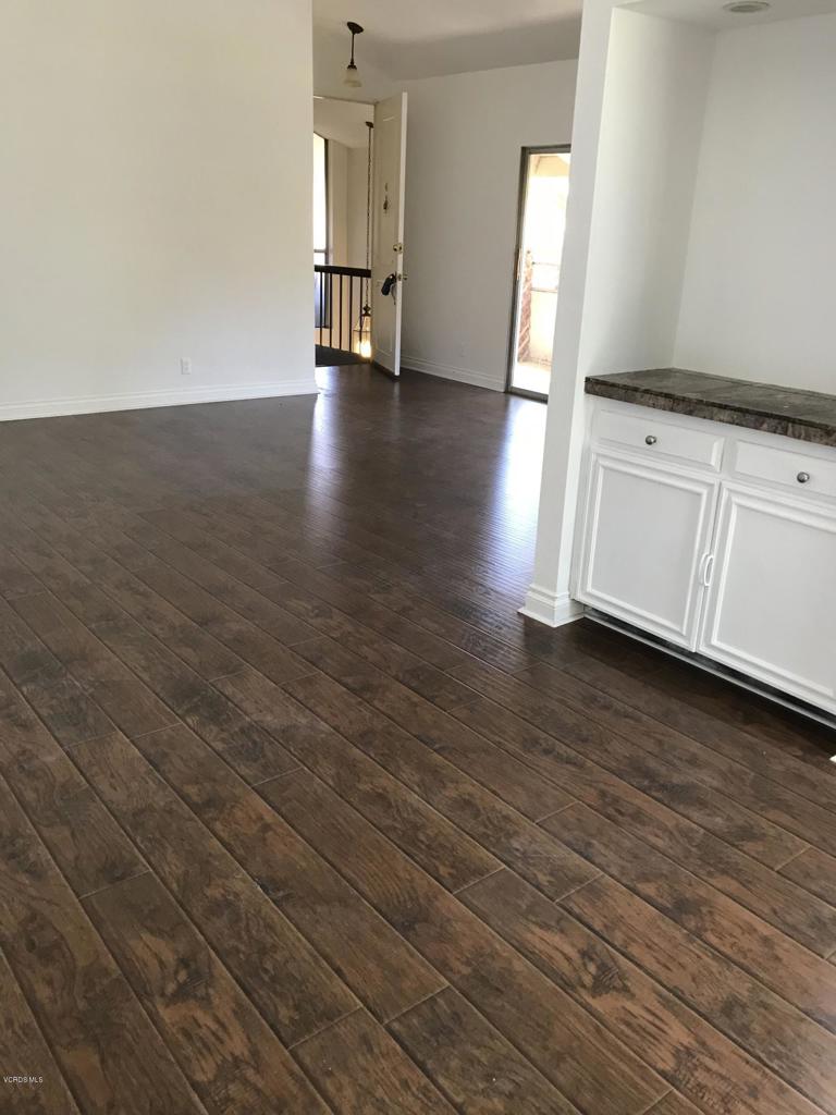 Westpark Condos in the heart of Westlake Village. Remodeled End Unit - Open floor plan. Wood/like flooring, blinds installed, stove and dishwasher. Baths remodeled. High ceilings. Travertine in baths and kitchen. Two car ports. Beautiful grounds with Pool, Spa, BBQ area.