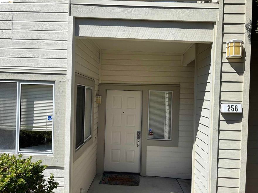 Beautiful, bright, and move-in ready! Spacious 3BD/2BA single-level end-unit in the desirable Bravo community. Freshly painted with an open floor plan, this home features laminate flooring in main areas, new carpet in bedrooms, and a cozy gas fireplace. The kitchen offers stainless steel appliances, ample cabinets, and hot water on tap. The large primary suite includes patio access, dual sinks, soaking tub, generous closet, and modern lighting. Two additional bedrooms provide flexibility for guests, office, or family. Enjoy two access points to the oversized private patio great for relaxing or entertaining—plus an outdoor storage area and detached 1-car garage. Scenic hillside setting with community pool, clubhouse, parks, and trails. Walk to Hanna Ranch Elementary, Hercules Middle/High Schools, and Refugio Valley Park. Near shopping, dining, Hwy 80/4, and public transit. HOA includes water, trash, and exterior maintenance. Downstairs unit with views from every window!