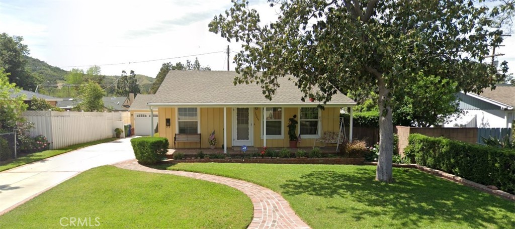 Nestled in the tranquil foothills of Sunland-Tujunga, this charming 3 bed, 2 bath, approximately 1,450 sq ft single-family home on a 6,454 sq ft lot combines classic character with modern comforts. With upscale touches like a cozy fireplace, in unit laundry, central air, and a spacious detached two-car garage plus driveway, it offers the perfect blend of functionality and style. The generous backyard invites alfresco dinners, garden relaxation, or weekend entertaining. Located minutes from Foothill Blvd’s boutique shops, upscale dining, and top rated schools: Sunland Elementary, Mt. Gleason Middle, and Verdugo Hills High. This residence delivers both convenience and community. Sorry, no pets.