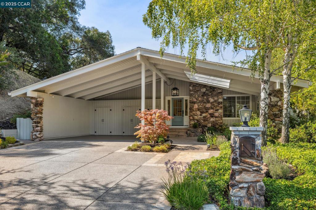 Open Sat. & Sun. 1-4. Downtown Lafayette Pocket Full of Sunshine - Tucked at the end of a peaceful, flat cul-de-sac just moments from downtown and the Lafayette Trail, this sunlit, beautifully updated home embodies the easy grace of California living. Its open, airy floor plan & wide-plank maple floors create a seamless flow, inviting you to gather, unwind, and feel instantly at home. The formal entry leads to a bright living room with a wall of windows. The updated eat-in kitchen features stainless appliances, marble countertops, Kohler sink, and breakfast bar that flows into a cheerful great room with floor-to-ceiling windows and casual dining nook. A light-filled formal dining room with built-in cabinetry is ideal for entertaining or everyday meals. The main-level primary suite is a quiet retreat with remodeled bath, custom vanity, quartz countertop, designer tile, and skylight. Upstairs, three bedrooms share a spacious hall bath in a private wing. Glass doors open to a backyard oasis with patio, lush lawn, veggie beds, and serene views—perfect for morning coffee, afternoon play, or evening gatherings. 1023 Ameno Ct. will capture your heart!