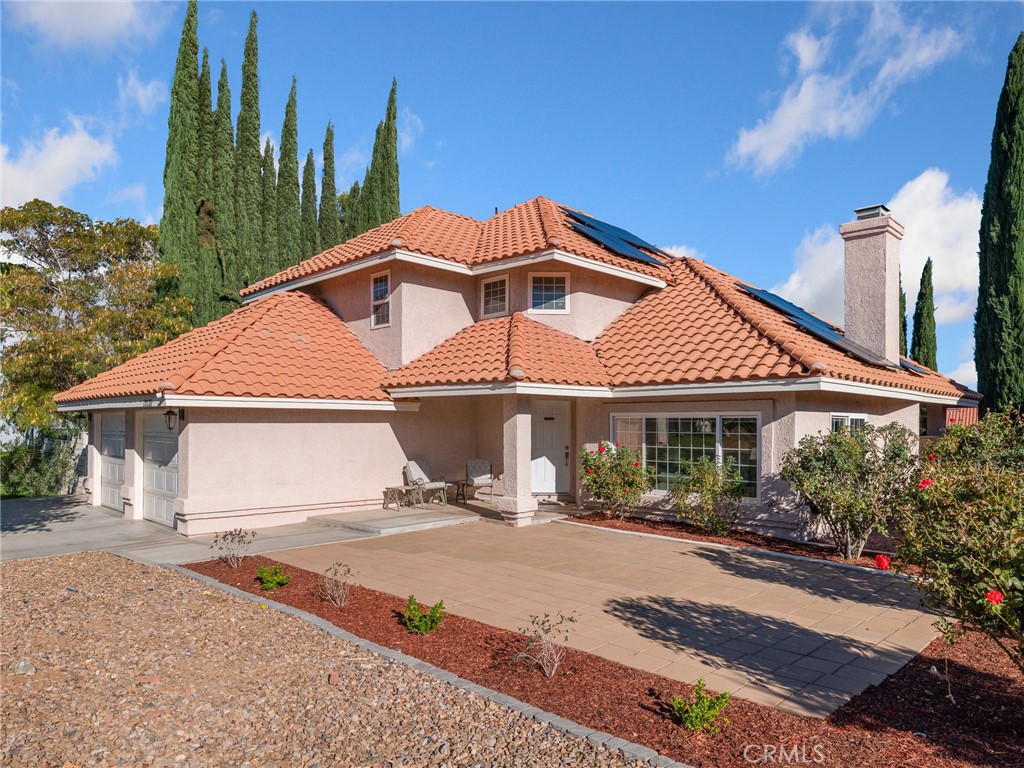 Welcome to 13135 Yellowstone Ave-a stunning two-story residence in Victorville’s sought-after Spring Valley Lake community. This 3-bedroom, 3-bathroom, 2,286 sq. ft. home on a 7,560 sq. ft. lot perfectly combines style, comfort, & modern energy efficiency. Inside, you’ll love the wood laminate flooring throughout most of the home & tile flooring in the entry, kitchen, & bathrooms. The formal living room impresses with cathedral ceilings, large windows, and a cozy fireplace, while the formal dining area is ideal for entertaining. The upgraded kitchen features granite countertops, stainless steel appliances, pantry, & a large garden window overlooking the lush backyard. The breakfast bar opens to the family room that includes a second fireplace, ceiling fan, & sliding glass door leading to the covered patio—the perfect space to relax or host gatherings. Enjoy the wet bar with granite countertops & glass faced cabinets to display your favorite items, a guest half bath with granite countertop & vessel sink, & a laundry room with granite countertop to make folding your laundry easy & storage cabinets for convenience. Upstairs, the primary suite offers a peaceful retreat with ceiling fan, walk-in closet, vanity/desk area, & a spa-like bathroom featuring a travertine shower, soaking tub, & granite counter top with dual vessel sinks. Both guest bedrooms include ceiling fans & mountain views, sharing an upgraded full bath with travertine surround of the tub/shower combo & large granite countertop with vessel sink. Energy efficiency shines with a solar system installed November 2023 (to be paid off at closing) & a dual battery Tesla Powerwall system, providing no electric bill & even a small credit from So Ca Edison! Additional features include a new water heater (2024), A/C (2021), smart thermostat, attached finished 2-car garage with openers, & RV/boat parking. Outside, enjoy a fully fenced backyard with green lawn, garden area, & storage shed + a covered patio. Large patio in front plus low-maintenance rock landscaping. Enjoy all the amenities Spring Valley Lake offers: a 200-acre lake perfect for water sports, a beach area for sunbathing & swimming, & 14 fishing areas. The community center hosts events for all ages, & 24-hour security patrol ensures peace of mind. For even more recreation, join the Bear Valley Country Club, featuring a Robert Trent Jones 18-hole golf course, tennis, pickleball, racquetball, fitness center, Olympic-sized pool, jacuzzi, & sauna.
