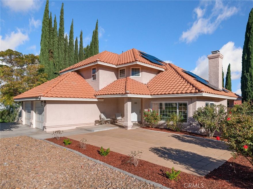 Welcome to 13135 Yellowstone Ave-a stunning two-story residence in Victorville’s sought-after Spring Valley Lake community. This 3-bedroom, 3-bathroom, 2,286 sq. ft. home on a 7,560 sq. ft. lot perfectly combines style, comfort, & modern energy efficiency. Inside, you’ll love the wood laminate flooring throughout most of the home & tile flooring in the entry, kitchen, & bathrooms. The formal living room impresses with cathedral ceilings, large windows, and a cozy fireplace, while the formal dining area is ideal for entertaining. The upgraded kitchen features granite countertops, stainless steel appliances, pantry, & a large garden window overlooking the lush backyard. The breakfast bar opens to the family room that includes a second fireplace, ceiling fan, & sliding glass door leading to the covered patio—the perfect space to relax or host gatherings. Enjoy the wet bar with granite countertops & glass faced cabinets to display your favorite items, a guest half bath with granite countertop & vessel sink, & a laundry room with granite countertop to make folding your laundry easy & storage cabinets for convenience. Upstairs, the primary suite offers a peaceful retreat with ceiling fan, walk-in closet, vanity/desk area, & a spa-like bathroom featuring a travertine shower, soaking tub, & granite counter top with dual vessel sinks. Both guest bedrooms include ceiling fans & mountain views, sharing an upgraded full bath with travertine surround of the tub/shower combo & large granite countertop with vessel sink. Energy efficiency shines with a solar system installed November 2023 (to be paid off at closing) & a dual battery Tesla Powerwall system, providing no electric bill & even a small credit from So Ca Edison! Additional features include a new water heater (2024), A/C (2021), smart thermostat, attached finished 2-car garage with openers, & RV/boat parking. Outside, enjoy a fully fenced backyard with green lawn, garden area, & storage shed + a covered patio. Large patio in front plus low-maintenance rock landscaping. Enjoy all the amenities Spring Valley Lake offers: a 200-acre lake perfect for water sports, a beach area for sunbathing & swimming, & 14 fishing areas. The community center hosts events for all ages, & 24-hour security patrol ensures peace of mind. For even more recreation, join the Bear Valley Country Club, featuring a Robert Trent Jones 18-hole golf course, tennis, pickleball, racquetball, fitness center, Olympic-sized pool, jacuzzi, & sauna.