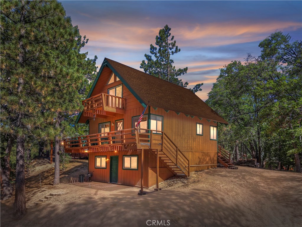 A beautiful mountain cabin in the quaint community of Green Valley Lake. Original features include a granite fireplace and wood beam ceilings. A complete kitchen with attached eating area bring family and friends together for a home cooked meal, holiday feast or games galore. Two bedrooms are upstairs with vaulted ceilings. Large downstairs area can be a primary suite or family room with attached bath. Also area for laundry hookup. Indoor access to build-up area and "man cave". Plenty of parking on a long private driveway. A great price for a weekend get away!