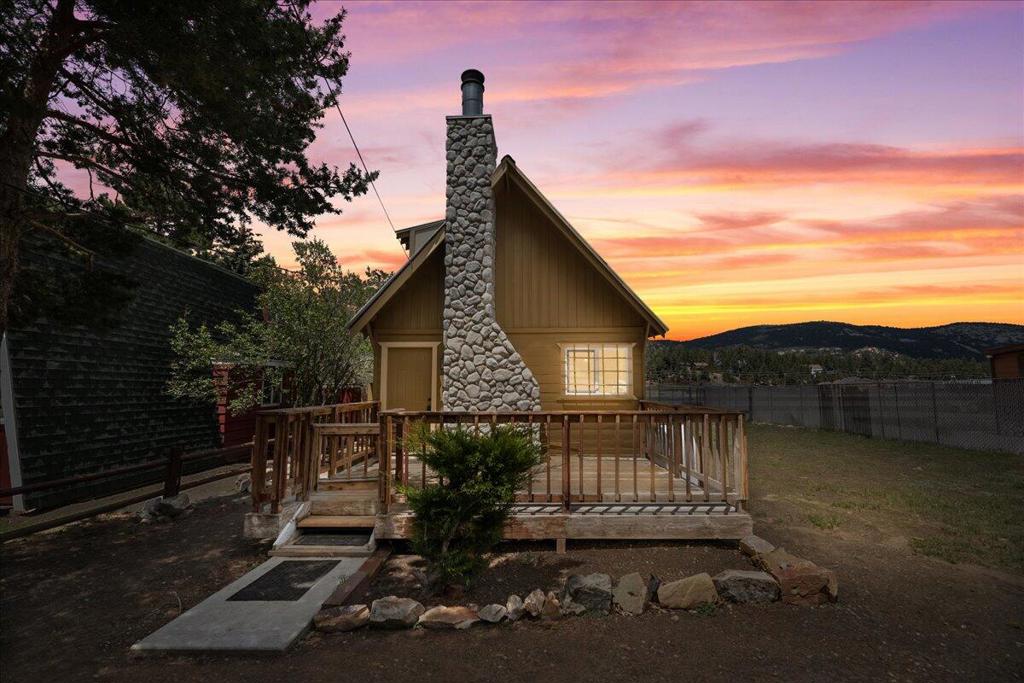 Don't miss this adorable mountain cabin--a fantastic opportunity with endless potential! Featuring 2 cozy bedrooms and 1 bath, this home has been thoughtfully upgraded with new carpet, fresh paint, a remodeled bathroom, a new hot water heater, and a durable metal roof. Located just down the street from the Big Bear Convention Center, you'll be within walking distance of Farmer's Market, Oktoberfest, and other exciting local events. Plus, with the Big Bear Airport as your backdrop, you'll enjoy expansive mountain views and wide-open skies. An added bonus? The vacant lot next door, with its own APN, is included! Whether you dream of building another home, adding a garage, or simply enjoying extra space, the possibilities are endless. At such a great price, this charming retreat is just minutes from the lake, ski slopes, and shopping. Come check it out today and start making unforgettable Big Bear memories!