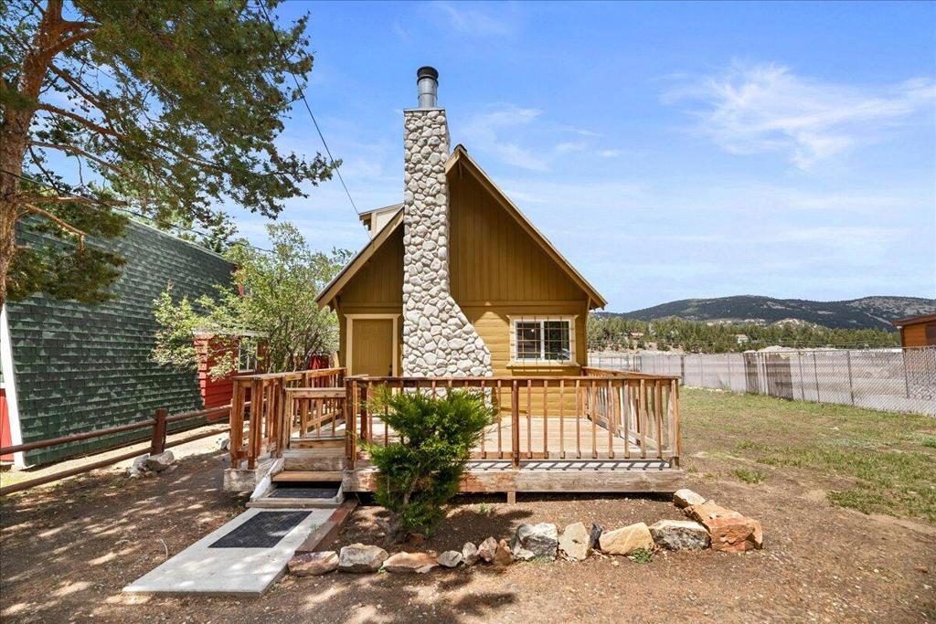 Don't miss this adorable mountain cabin--a fantastic opportunity with endless potential! Featuring 2 cozy bedrooms and 1 bath, this home has been thoughtfully upgraded with new carpet, fresh paint, a remodeled bathroom, a new hot water heater, and a durable metal roof. Located just down the street from the Big Bear Convention Center, you'll be within walking distance of Farmer's Market, Oktoberfest, and other exciting local events. Plus, with the Big Bear Airport as your backdrop, you'll enjoy expansive mountain views and wide-open skies. An added bonus? The vacant lot next door, with its own APN, is included! Whether you dream of building another home, adding a garage, or simply enjoying extra space, the possibilities are endless. At such a great price, this charming retreat is just minutes from the lake, ski slopes, and shopping. Come check it out today and start making unforgettable Big Bear memories!