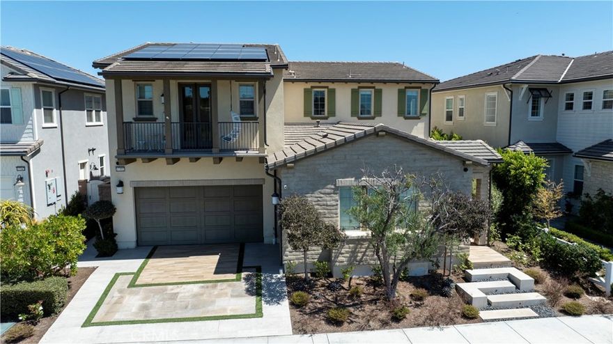 Nestled in one of Huntington Beach’s most coveted communities, Parkside Estates, this stunning (Residence 2) 5-BEDROOM (DOWNSTAIRS MASTER), 5.5-BATH VIEW HOME with over 3,800 SQFT of living space offers unbeatable privacy, luxury, and upgrades… and it’s all set on a premium SINGLE-LOADED WEST-FACING LOT with panoramic VIEWS OF THE OCEAN, Bolsa Chica Wetlands, Bluffs, and Catalina on clear days. Built in 2020 by Shea Homes, there is a reason why these 111 homes within the community are sought after. But this one’s special. Walking to the front door past the CUSTOM ENTRY WALKWAY with its peaceful WATERFALL FEATURE, you’ll feel a sense of calm, which foreshadows what lies ahead. Inside, engineered WOOD FLOORING flows through a modern layout designed for effortless entertaining and everyday comfort. The open-concept kitchen showcases an UPGRADED APPLIANCE PACKAGE, TWO DISHWASHERS, LEATHERED GRANITE COUNTERTOPS, and a walk-in pantry. The kitchen flows seamlessly into the expansive GREAT ROOM and dining areas. The backyard features a COASTAL CALIFORNIA ROOM with a fireplace, OUTDOOR HEATERS, built-in SOUND SYSTEM, and a STRUXURE-AUTOMATED PATIO COVER. If that’s not enough, enjoy your time in the custom “SPOOL” spa/pool framed by a silver sheen privacy hedge. There’s no better place to gather with family and friends than right here. And if you want your own private escape, just turn on the backwall waterfall and let the soothing sounds of running water take you away. One of the biggest reasons this floor plan is popular, is because it has a rare and desirable DOWNSTAIRS PRIMARY SUITE, complete with a spa-like bathroom, CUSTOM-BUILT CLOSET, and its own STACKABLE LAUNDRY for added convenience. Upstairs, enjoy a spacious MEDIA ROOM with wraparound windows, SUNSET VIEWS, and a BONUS BAR/KITCHENETTE. Each bedroom has access to their own bathroom/shower, and the upstairs front bedroom includes a PRIVATE BALCONY overlooking the park, bluffs, and trails just steps away. Other premium upgrades include PAID SOLAR PANELS with backup BATTERIES, UPGRADED CABINETRY with dovetail construction and added uppers, BUILT-IN GARAGE STORAGE, SOUNDPROOFING, a full SECURITY CAMERA system, RING system, DUAL ZONE ACs, DUAL TANKLESS WATER HEATERS, and CENTRAL VACCUM. Quiet, walkable to local parks, trails, playgrounds, and conveniently located near spots like Sweet Elle’s, Café Cup, and the beach, this is more than a home. It’s a dream made coastal. Don’t wait!