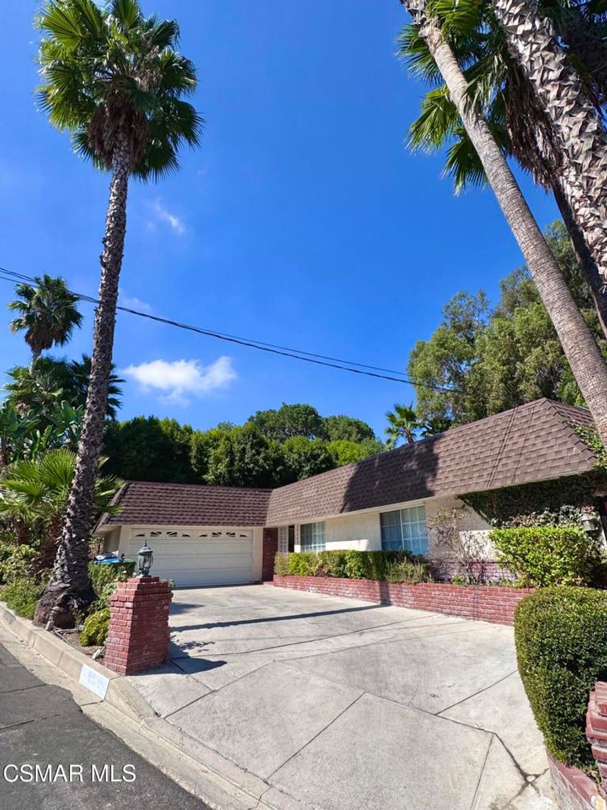 Beautifully remodeled 4 bedroom, 3 bathroom home in prime neighborhood in Woodland Hills. This spacious one story boasts a bright open floor plan, a large kitchen with stainless steel appliances, granite countertops, custom cabinetry, center island and open to dining room. The living room has a garden view, elegant fireplace and sky lights. Primary bedroom has high ceilings, garden and pool views, large en-suite bathrooms with separate shower and soaking tub and plenty of closet space. The home has a second ensuite bedroom with remodeled bath, and walk in shower. Newer laminate flooring throughout. Spacious back yard with low maintenance artificial grass and a large private pool, recently re-plastered. Located within close proximity to freeway, Westfield shopping center and parks.