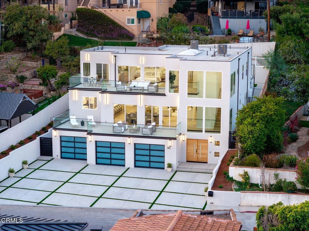 Perched above Ventura's stunning coastline, this newly built home offers 4,200 sq. ft. of luxury with 4 bedrooms and 5 bathrooms. Expansive glass walls showcase sweeping ocean views, while three oversized decks create seamless indoor-outdoor living--perfect for entertaining or savoring golden sunsets.A full-sized elevator connects all levels, adding ease and accessibility. The open-concept great room flows into a sleek chef's kitchen with Cafe fridge and dishwasher, ideal for gatherings. The primary suite is a private retreat with a walk-through closet, spa-inspired bath, and breathtaking vistas, while each additional bedroom combines comfort and style.The backyard features multiple entertaining spaces, a BBQ, and a deck with potential for a pool or large spa. Built with premium fire-resistant materials, this home blends modern design with lasting durability. Located in one of Ventura's most coveted hillside neighborhoods, you're minutes from the beach, downtown dining, and scenic trails. 2407 Sunset Drive defines California coastal luxury.