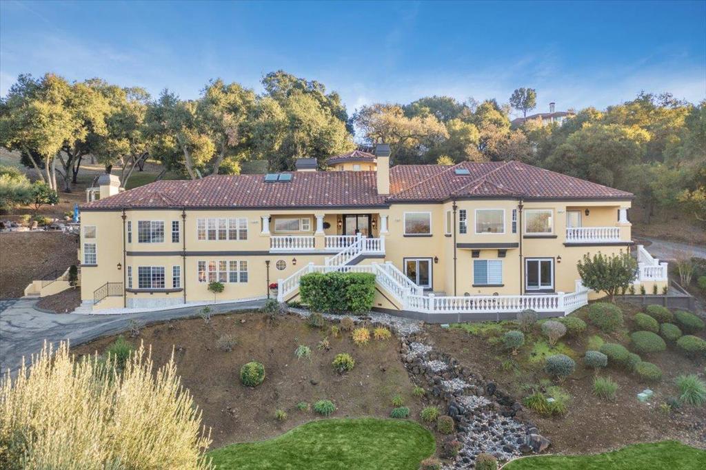 Villa Sul Lago | 4Bd/4Ba | 5,000 SQFT | Secluded & Secure Key Code Gated Enclave of Eleven Custom Homes | Approx 1.4 Acres | Lake & City Views | Updated High-end Chef's Kitchen | Beautiful Landscaped Grounds: Imported Stone Pergola, Cascading Waterfall Spa, Fire Pit, & Full Outdoor Kitchen w/ Pizza Oven | Master Suite w/ Sitting Room, Fireplace | Resort Style Master Bath with Two Large Walk-in Closets, Soaking Tub & Walk-in Shower | Full Storage Wine Library | 3 Car Garage | Built in Surround Sound Stereo System throughout House... Estate Sale. Property Vacant, Move in Ready. Seller open to Paying Points for Buyer Rate Buydown and covering Buyer Closing Costs. Almost $100k in Heavily Discounted Tangible Personal Property (All Staged Furniture, Chandeliers, etc) included in List Price, available to Buyer at their discretion. Detailed Auction House Appraisals Available. Inter-Generational Living Possible with Separate Entrances and Kitchen within Lower Level. Space Available in Rear Yard near Spa for Pool and expansion via ADU. Highly Motivated Sellers: All Offers to be Reviewed and seriously Considered. Prefer Fast Clean Close!