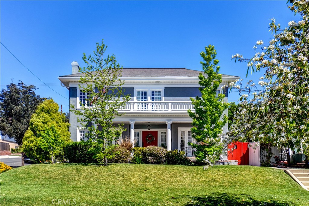 This unique Federal Revivalist style home offers a blend of original charm and modern updates. Main house features 4 spacious bedrooms and 2.5 bathrooms. Main house square footage 2,936 square feet and ADU square footage 371 square feet.
This timeless classic has original wood floors, and crown molding and vintage details preserved throughout. The kitchen includes quartz countertops, a farm sink, vintage gas stove, updated range hood, French windows, and ample cabinet space. Off the kitchen is a laundry/mud room with new flooring along with a newly remodeled half bath. Between the kitchen and dining room is a bonus entertaining or dining space. The spacious living room with the original Batchelder fireplace offers a more formal gathering space. A large family room creates a cozy atmosphere for family time. This home features a spacious basement/wine cellar and extra storage throughout.
Upstairs, the expansive primary suite includes a full wall of built-in closets, a fully remodeled en-suite bathroom, and French doors that open to a private balcony with views of the neighborhood hills, city, and, at a distance, the downtown Los Angeles skyline. Three additional large bedrooms are located upstairs, along with a spacious full bathroom that retains its original tub and tile.
A charming, permitted, two-room detached ADU with kitchenette, full-sized bathroom with shower, and central air/heat offers flexibility for guest space or rental income. Private two-car driveway with garage/storage space.
Additional upgrades include PEX/copper plumbing, main water lines, sewer lines, electrical panel, fresh exterior paint, brick paver patio and walkways, and a newly installed HVAC system upstairs. This home is Mills Act eligible.
Amazing neighborhood within walking distance to Uptown Whittier shops, dining, hiking & bike trails, Whittier College, and just minutes to 605 freeway access.
