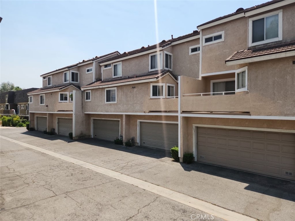 Welcome to this beautiful tri-level townhome! This spacious home offers an inviting and functional layout with generous natural light throughout. Key features include two primary suites, each bedroom with a private bathroom and spacious closets. Living room with vaulted ceilings and gas fireplace. Formal dining area overlooking the living room, ideal for entertaining. Updated kitchen adjoining a family room and powder room—perfect flow for daily living. Attached 2-car garage parking with in-unit laundry. Community amenities include a sparkling pool and hot tub. Conveniently situated in central San Fernando, within walking distance to local shops, restaurants, and public transit. Easy access to Los Angeles Mission College and major freeways, including the 118, 210, and 405, for an effortless commute!