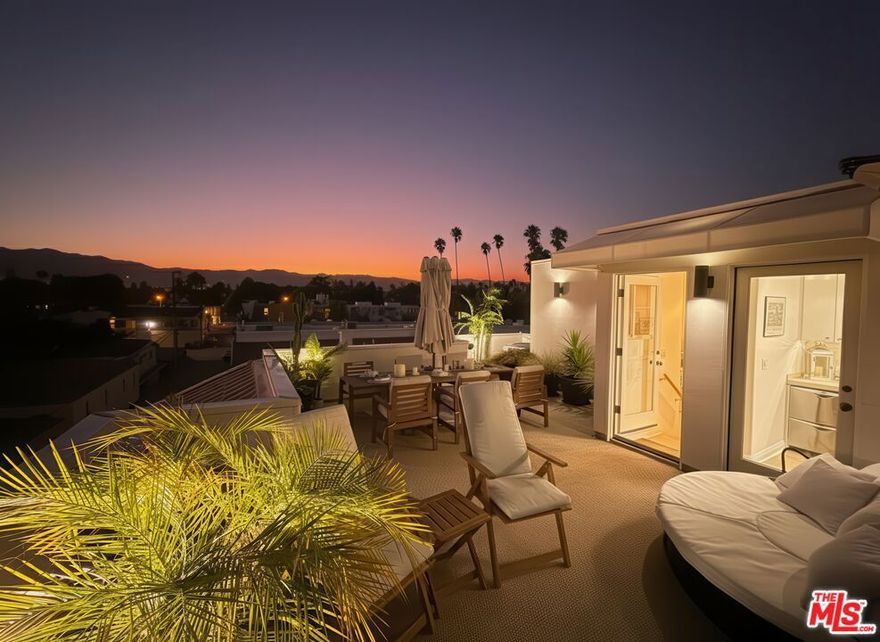 Crowned by panoramic ocean, mountain, and city views from a private 400 sq ft rooftop deck, this contemporary Santa Monica end-unit townhome sits just a half block from Montana Avenue's boutiques and cafs. Multi-level living blends space, light, and luxe upgrades: soaring ceilings, Italian-oak floors, and walls of windows that invite sunshine and breezes into every room. Arrive via a gated complex on a quiet, upscale street. A palm- and succulent-lined breezeway leads to the private end unit.The location is exceptionally walkable: steps to 100+ shops and restaurants on Montana Ave. Within a block: library, coffee shops, salons, and multiple eateries. Three blocks to Whole Foods, Target, & the Aero Theater. Minutes to the beach and Santa Monica Pier. Perched high on 17th Street, the elevation delivers blue-water views from bedrooms and roof deck, with natural cross-breezes throughout.In the spa-level primary bath, indulge in a steam shower or switch to the rain head and five body sprays. Customizable lighting sets the mood, while a shower window frames Catalina on clear days. The updated kitchen features Spanish subway tile, white quartz counters, and matte-black smart appliances, including a French-door oven with LED touchscreen. The dramatic living room soars with 17 ft ceilings and a custom built-in with integrated lighting plus a smooth-rolling 10 ft library ladder. A guest BR sits on the second level beside a reading or office nook. The primary suite and another bedroom are on the third level. The 1st-floor dining room opens to a porch, perfect for a bistro breakfast, herb garden, or outdoor grill.Upgrades abound: sleek screwless switch plates, in-wall USB outlets, double handrails, soft-close cabinetry with bamboo organizers, three recessed outlets for flush TVs, double-dishwashers at both kitchen and roofdeck level. Recent updates include high-capacity water heater, oven, range, microwave, dishwashers, garage opener, and shower fixtures.The show-stopping roof deck is an entertainer's dream. With gas, water, electricity, plus a kitchenette with sink, refrigerator, and dishwasher, it's made for sunset dinners, cabana lounging, game days, or mornings watching hawks ride the updrafts. A rare 400 sqft basement bonus room offers flexible use: game room, playroom, gym, or theater. Semi-subterranean cinder-block construction ensures excellent sound isolation and complete darkness. Pre-wired for surround sound. In the corner is a small office with acoustic insulation and built-in California Closets storage.Technology and comfort converge in the turnkey smart-home package with 100+ Philips Hue lights. All smart enabled: 6 security cameras, doorbell, deadbolt, garage door, thermostat, 3 HEPA air purifiers, 11 voice assistants, and motion sensors. Devices are pre-connected to Apple HomeKit and ready to sync with your iPhone. Control by voice or the included, pre-programmed iPad. Cue whole-home music, dim lights, or adjust climate by voice. Pre-set automations power down lights, music, and HVAC when unoccupied. Each floor has an Ethernet jack, and an Orbi mesh WiFi system with seven satellites delivers gigabit speeds. Prefer low tech? Property can be delivered with smart devices removed. Option to purchase furnished for a seamless move-in. A rare blend of modern design, luxury amenities, and postcard-worthy views, this home captures the essence of Santa Monica beach-city living from sunrise breezes to Pacific-pink sunsets.